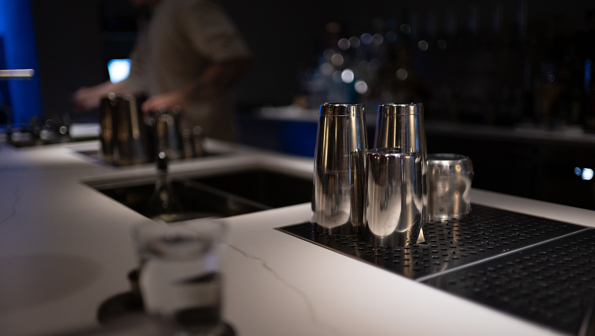 Stainless Steel Cocktail Shakers on Bar Counter